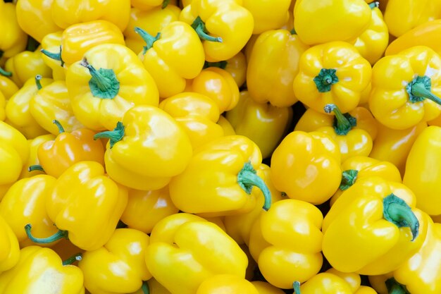 Pepper background yellow peppers close up