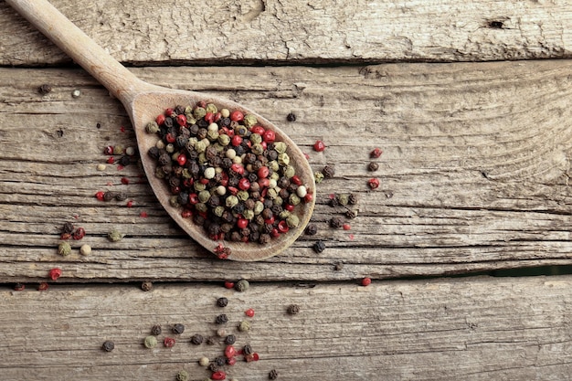 Pepper peas on wooden background