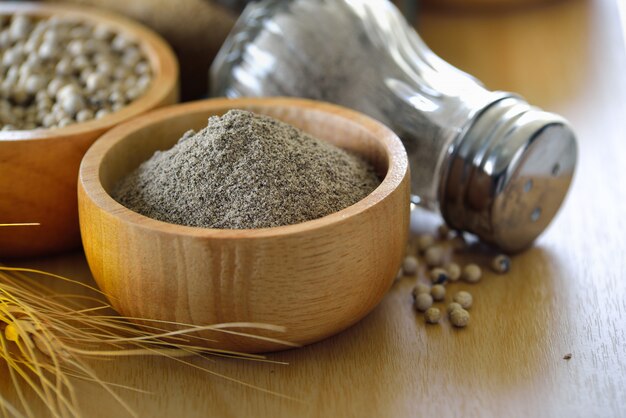 Peppercorn powder in a cup on table