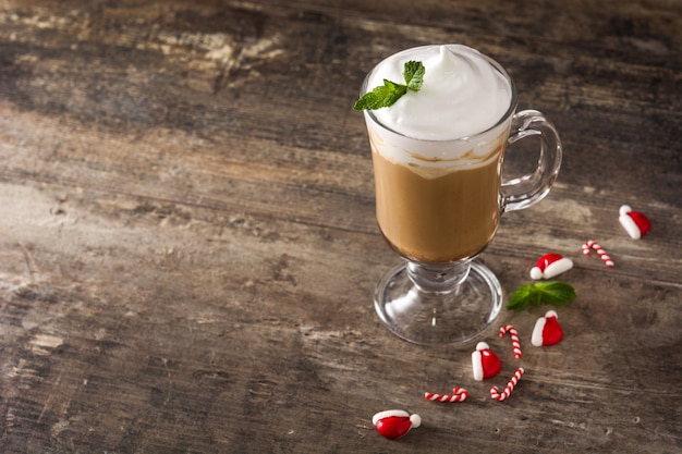 Peppermint coffee mocha for christmas on wooden table