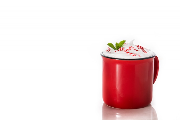 Peppermint coffee mocha decorated with candy canes for Christmas isolated  copyspace