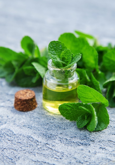 Peppermint essential oil in a small bottle