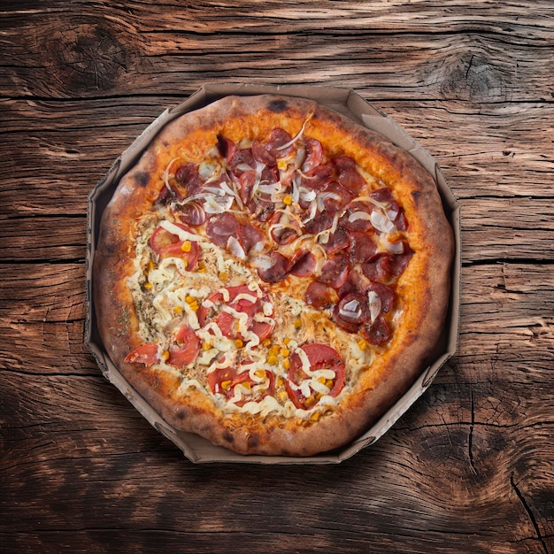 Pepperoni pizza and chicken with catupiry top view wooden background