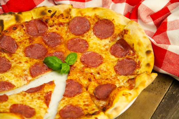 Pepperoni pizza on an old wooden table