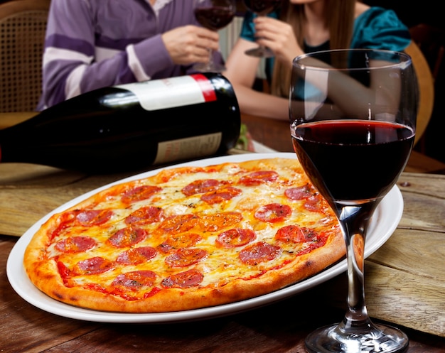 Pepperoni pizza and red wine