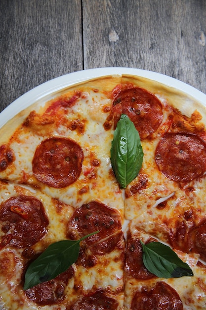 Pepperoni pizza on wood