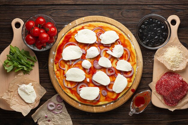  Pepperoni pizza on wooden board top view