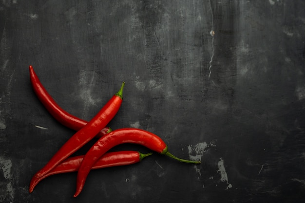 peppers, Cayenne red burning in front of Chile background