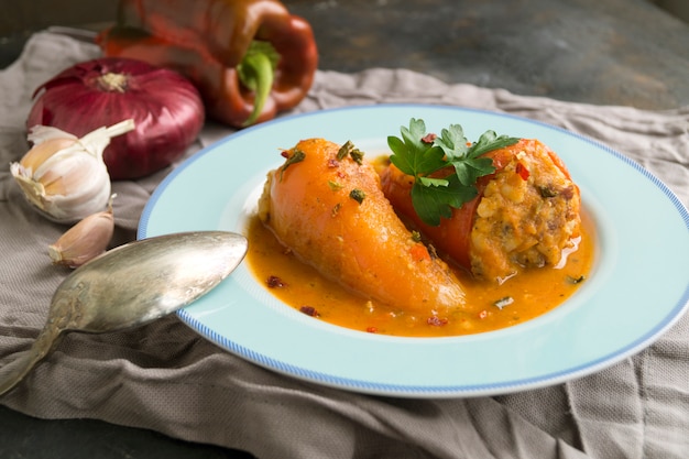 Peppers stuffed with minced meat in tomato sauce.