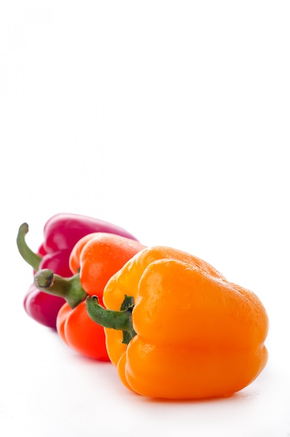 Peppers over white background