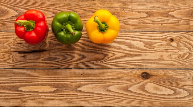 Peppers on a wooden background