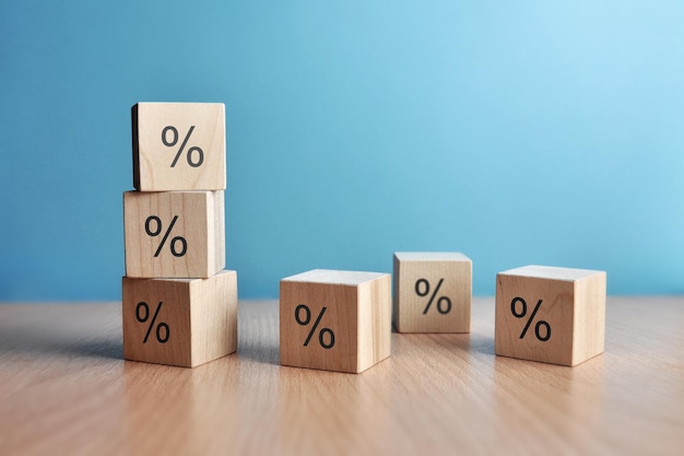 Percentage icons on wooden cubes on a blue background