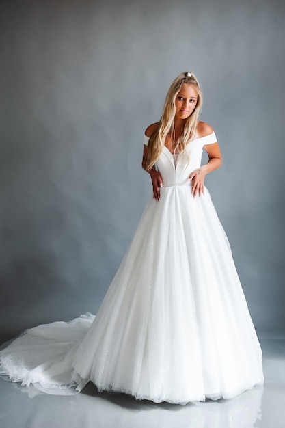 Perfect bride portrait of a girl in a long white dress