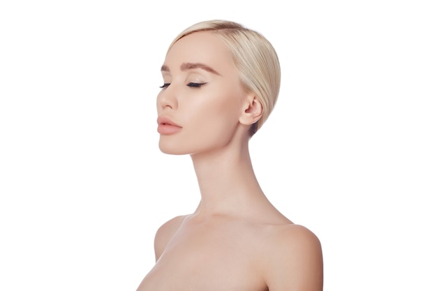 Perfect clean skin of a woman, a cosmetic for wrinkles. Rejuvenating effect on the skin care. Clean pores no wrinkles. Girl blonde on white background isolate, copy space. Healthy face skin