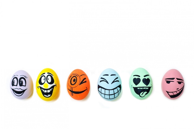 Photo perfect colorful handmade easter eggs with smile eggs isolated on a white background.