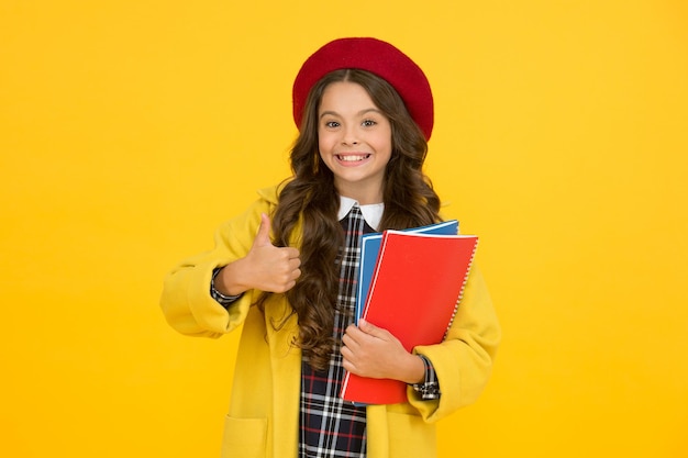 Perfect day kid school fashion cheerful child ready for schoolyear education happy childhood notebooks for learning at class back to school retro girl wear uniform and parisian beret