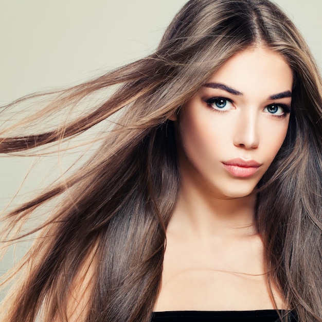 Perfect Girl with Long Healthy Hairstyle. Beautiful Woman Fashion Model with Brown Hair. Hair Care Concept