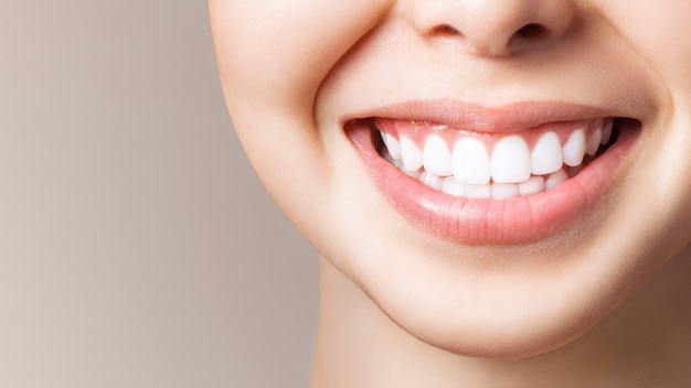 Perfect healthy teeth smile of a young woman. Teeth whitening. Dental clinic patient. Image symbolizes oral care dentistry, stomatology. Dentistry image.