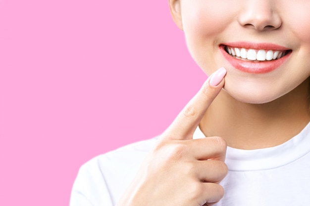 Perfect healthy teeth smile of a young woman. Teeth whitening. Dental clinic patient. Image symbolizes oral care dentistry, stomatology.