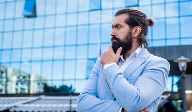 Perfect male facial hair care mature brutal man in formal wear fashionable bearded hipster wear stylish jacket confident and charismatic guy with beard and moustache outdoor male urban fashion