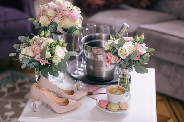 Perfect morning for the bride On the champagne table is a bouqu