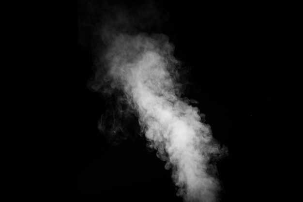 Perfect mystical curly white steam or smoke isolated on black background Abstract background fog or smog design element for Halloween layout for collages