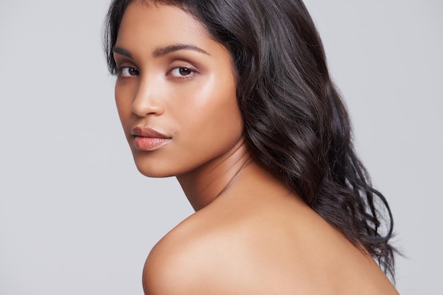 Perfect and natural beauty Shot of a beautiful young posing over a gray background