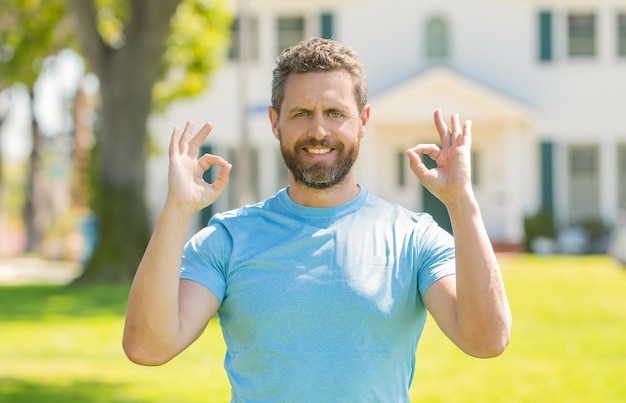 Perfect. real estate agent at house for sale. realtor welcoming visitors.