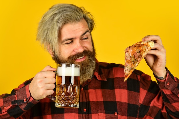 Perfect rest in pub Pizzeria restaurant Gourmet food I deserve some good pizza Italian food Man bearded hipster hold pizza Pizza delivery service Hungry man going to eat pizza and drink beer