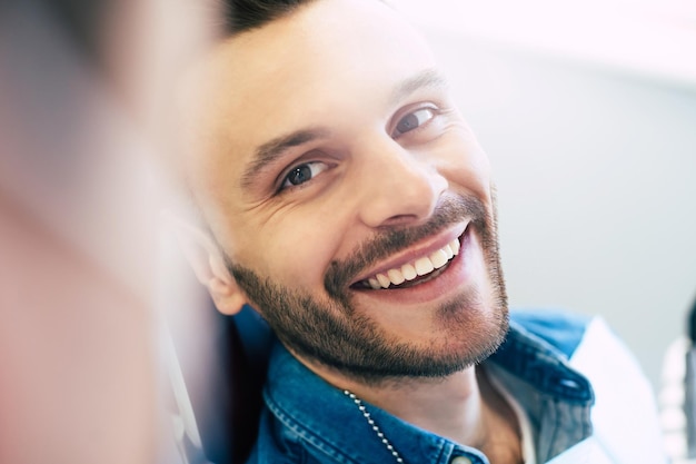 A perfect result of a dentistÃ¢ÂÂs work which is seen in the beautiful and white smile on a patient who is absolutely satisfied with a result of a treatment given in a clinic