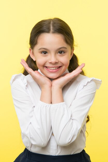 Perfect smile. Girl happy demonstrates her perfect smile yellow background. Schoolgirl can not wait to back to school. Waiting september. Pupil excited about back to school.