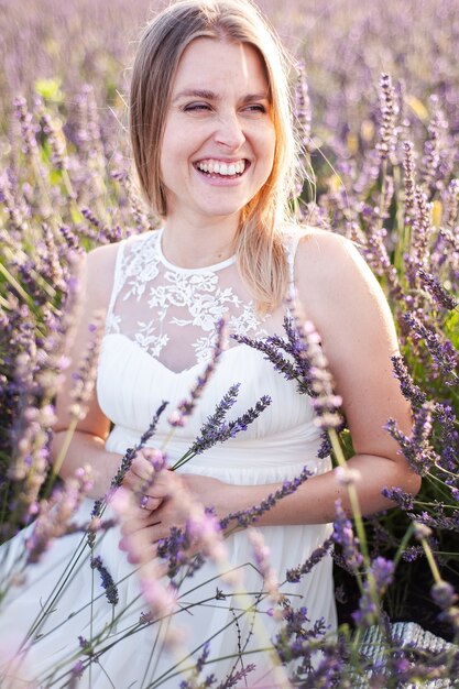 Perfect smiling blonde bride woman portrait outdoor