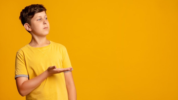 Perfect solution kid choice special offer information banner confident young boy in yellow tshirt