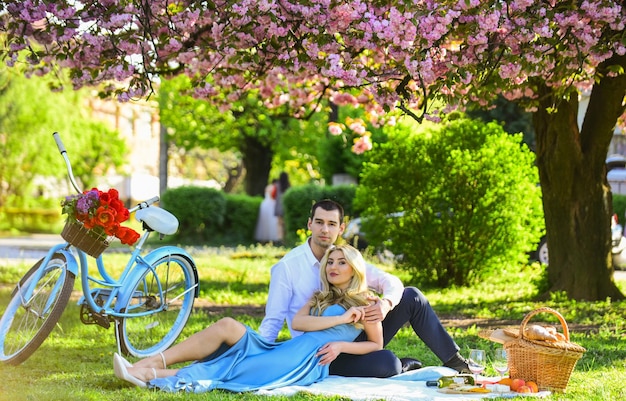 Perfect spring date Man and woman in love Picnic time Long lasting relationship Couple having picnic in local park Couple sit blanket Happy together Romantic picnic Idyllic moment in garden