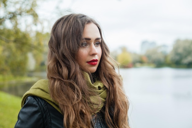 Perfect young woman outdoor autumn portrait