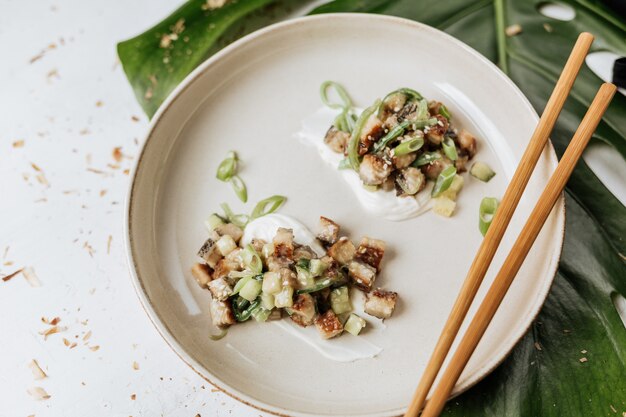 Perfectly served smoked eel tartare with vegetables in a restaurant.