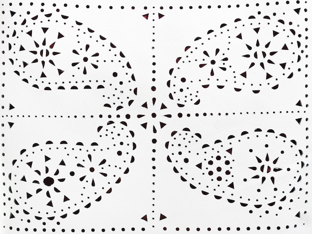 Photo perforated paisley pattern on white leather