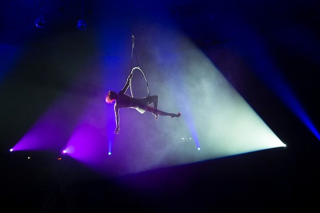 Performances of artists at a height under the dome of the circus

