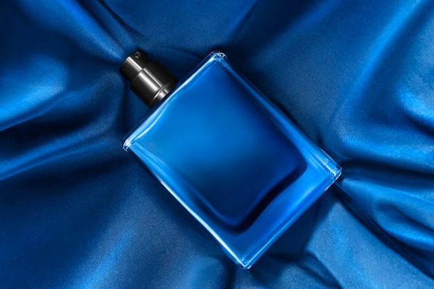 Perfume on blue silk