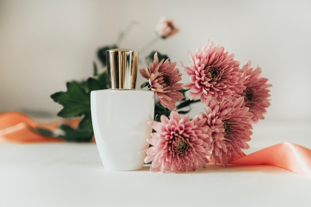 perfume bottle on a background of flowers