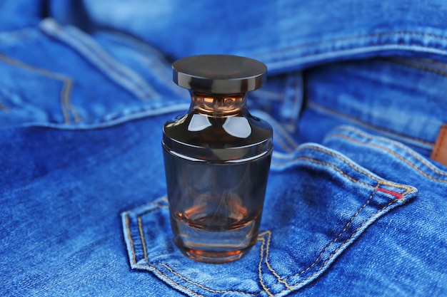 Photo perfume bottle on denim cloth