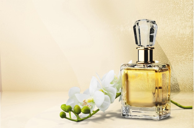 Perfume bottle and flowers on  background