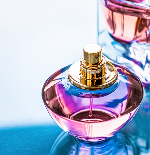 Perfume bottle on glossy background sweet floral scent glamour fragrance and eau de parfum as holida...