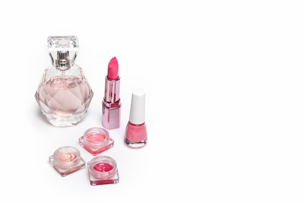 Perfume bottle, nail polish and lipstick