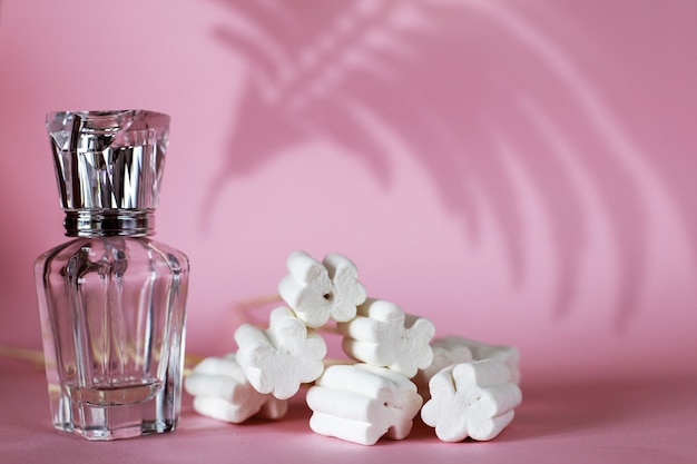 perfume bottle on a pink background