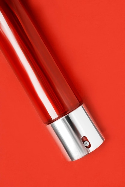 Perfume bottle on red