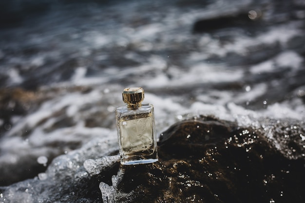 Perfume bottle on sea background