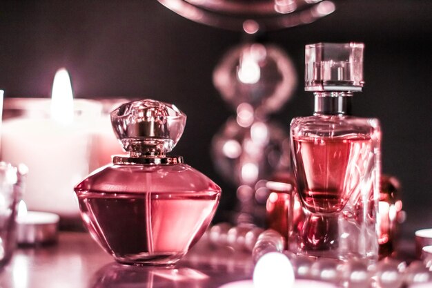 Perfume bottle and vintage fragrance on glamour vanity table at night pearls jewellery and eau de parfum as holiday gift luxury beauty brand present