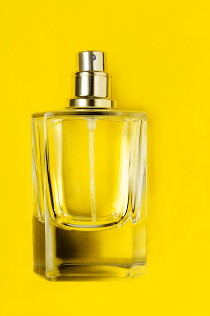 Perfume bottle on yellow