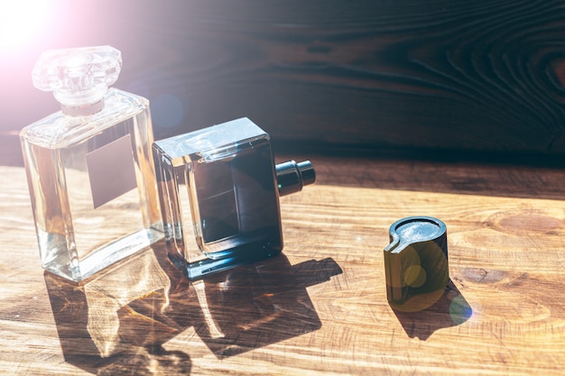 Perfume bottles sprayer on a wooden 